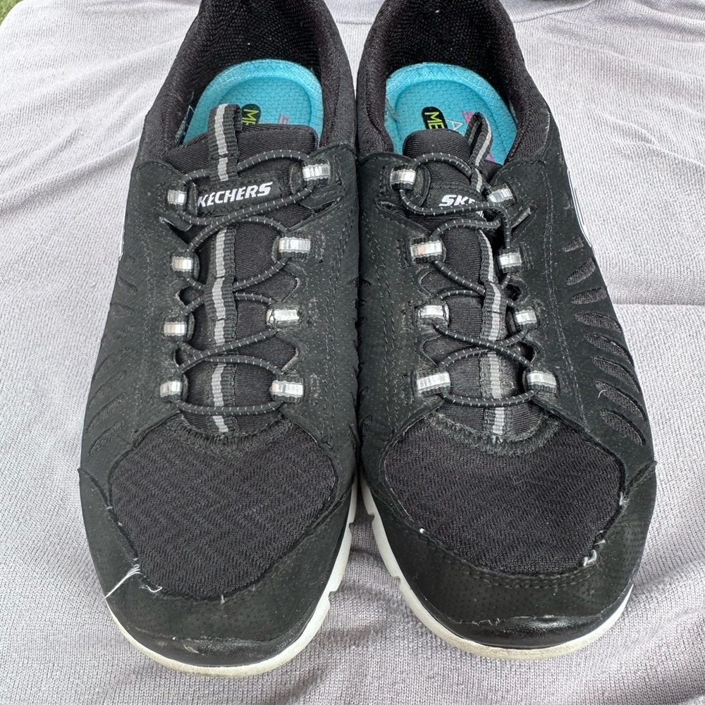 Skechers black slip on sneakers gently worn size 6